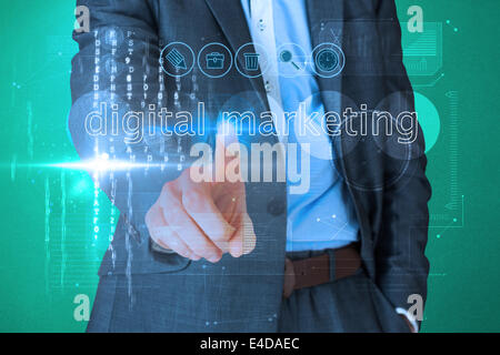Businessman touching the words digital marketing on interface Stock Photo