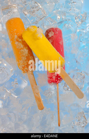 Fruit ice cream pops on ice Stock Photo