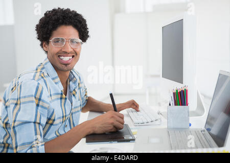 Young designer working at his desk with digitizer Stock Photo