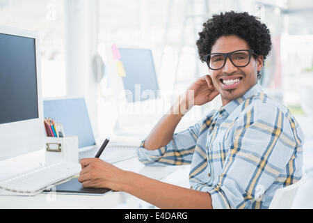 Young casual designer smiling at camera Stock Photo