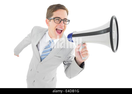 Geeky businessman shouting through megaphone Stock Photo