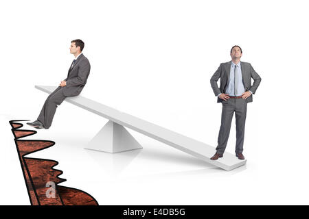 White scales measuring two businessmen Stock Photo