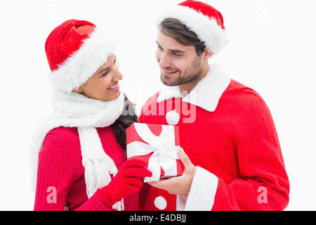 Attractive festive couple holding a gift Stock Photo