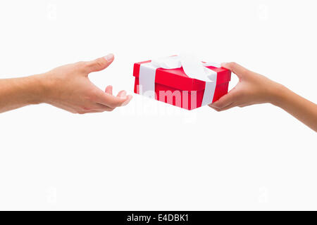 Woman passing man a gift Stock Photo