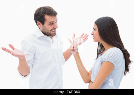 Angry brunette accusing her boyfriend Stock Photo
