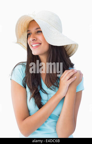 Happy young brunette wearing sunhat Stock Photo