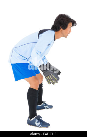 Goalkeeper in blue ready to save Stock Photo