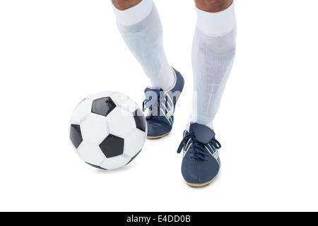 Football player kicking the ball Stock Photo