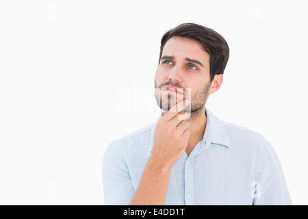 Serious thinking man looking up Stock Photo