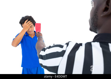 Serious referee showing red card to player Stock Photo