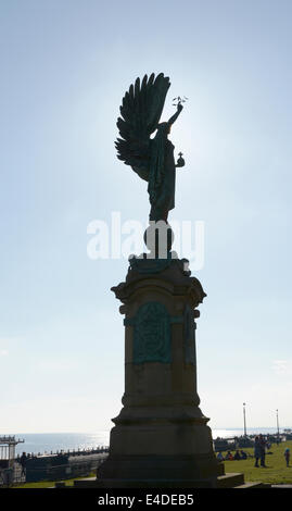 The Peace Statue on Hove seafront at Brighton. East Sussex. England. In silhouette. People in background Stock Photo