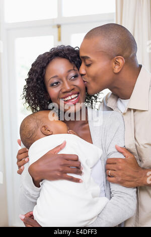 Happy young parents spending time with baby Stock Photo