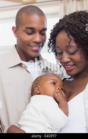 Happy young parents spending time with baby Stock Photo