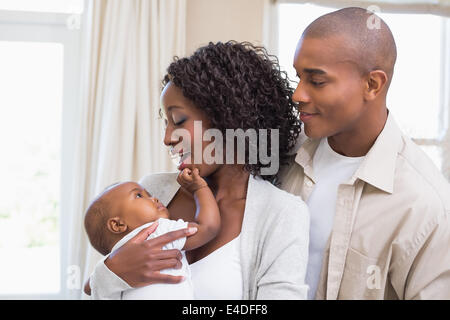 Happy young parents spending time with baby Stock Photo