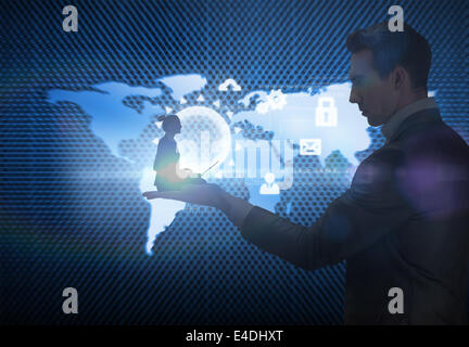 Composite image of businesswoman using laptop Stock Photo