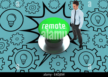 Remote against digitally generated green push button Stock Photo
