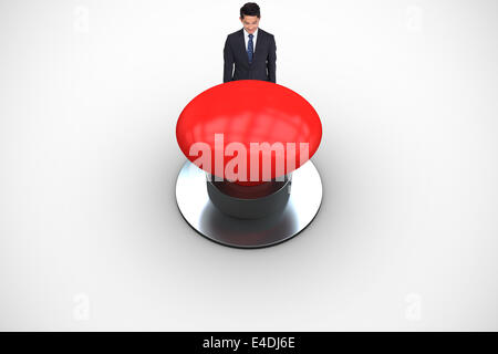 Composite image of smiling businessman looking down Stock Photo