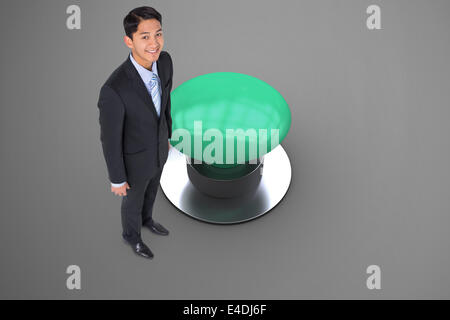 Composite image of smiling asian businessman Stock Photo