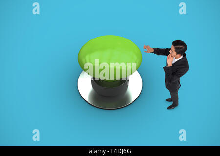 Composite image of thoughtful asian businessman pointing Stock Photo