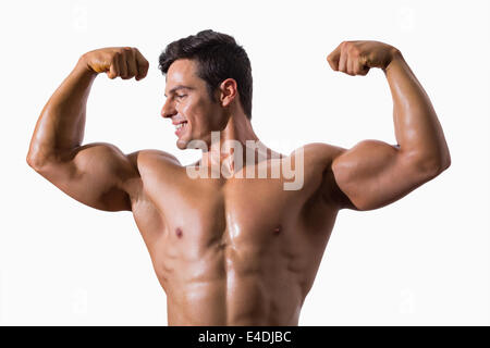 Portrait of a muscular young man flexing muscles Stock Photo