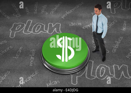 Composite image of happy businessman standing with hands in pockets Stock Photo