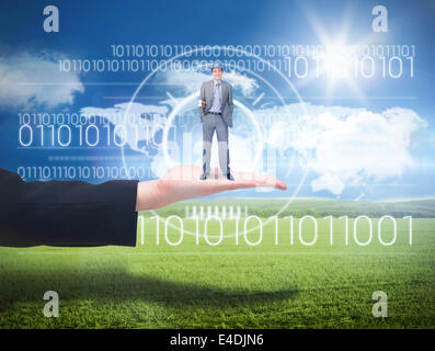 Composite image of smiling attractive architect on phone holding plans Stock Photo