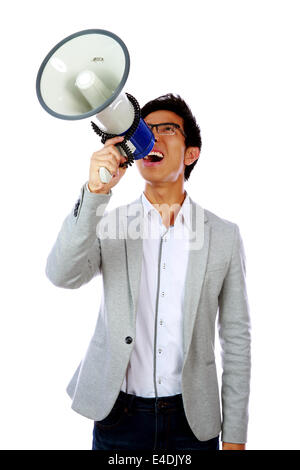 Portrait of young asian man shouting with megaphone Stock Photo