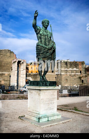 Rome, Italy. Ancient statue of Octavian Augustus (Ancient Rome first emperor) in front the remains Forum of Caesar. Stock Photo