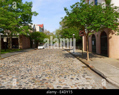Cobblestones of Chalmers Street, Charleston, South Carolina.  Cobblestones were originally used as ballast in sailing ships. Stock Photo