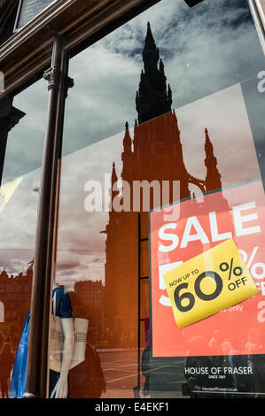 The Scott Monument reflected in a shop window on Princes Street, Edinburgh Stock Photo