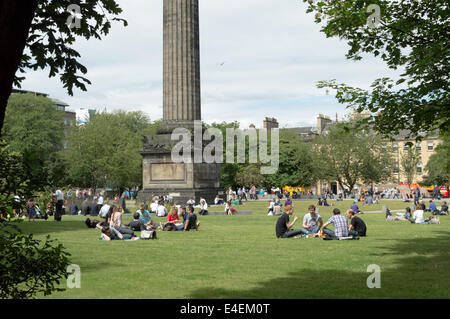 People enjoying the summer weather in St Andrews Square, Edinburgh Stock Photo