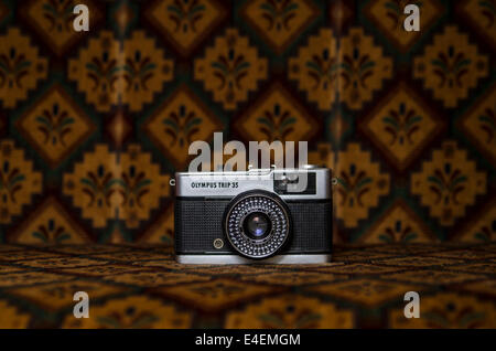 Olympus trip film camera on a patterned background Stock Photo