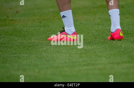 Munich, Germany. 09th July, 2014. The soccer shoe of Robert Lewandowski of German Bundesliga soccer club FC Bayern Munich is seen during a training session at the training area at Saebener Strasse in Munich, Germany, 09 July 2014. Photo: SVEN HOPPE/dpa/Alamy Live News Stock Photo