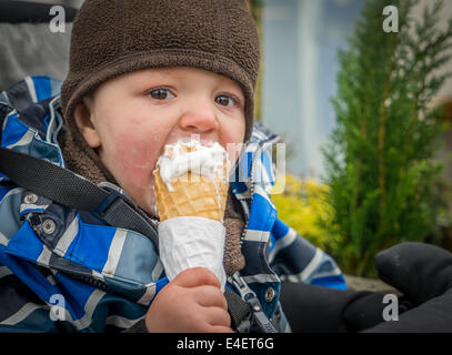 Toddler eating an Ice cream cone, Reykjavik, Iceland Stock Photo