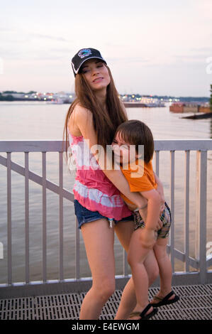 Mother Trying to Hold Upset Three Year Old Boy at Waterfeont Park in Louisville, Kentucky Stock Photo