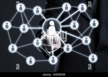 Businessman navigating social network connections on futuristic touch screen display Stock Photo
