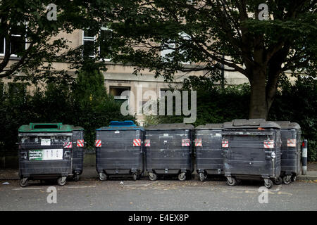 Large bins in a street in Edinburgh's Marchmont area Stock Photo