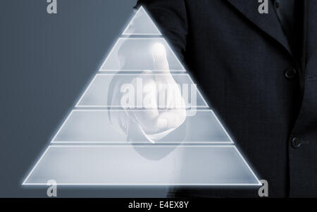 Businessman touching pyramid infogram graphics on virtual touchscreen with copy space Stock Photo