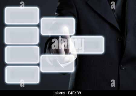 Businessman touching hierarchy infogram graphics on virtual touchscreen with copy space Stock Photo