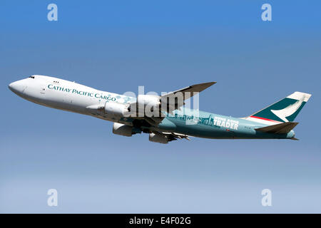 A Boeing 747-800 Cathay Pacific Cargo Hong Kong Trader in flight over Italy. Stock Photo