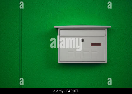 white mailbox on green background Stock Photo