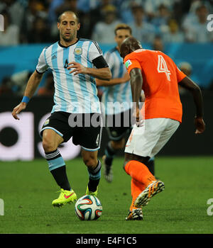 Sao Paulo, Brazil. 9th July, 2014. Netherlands' Bruno Martins Indi vies with Argentina's Pablo Zabaleta during a semifinal match between Netherlands and Argentina of 2014 FIFA World Cup at the Arena de Sao Paulo Stadium in Sao Paulo, Brazil, on July 9, 2014. Credit:  Xu Zijian/Xinhua/Alamy Live News Stock Photo