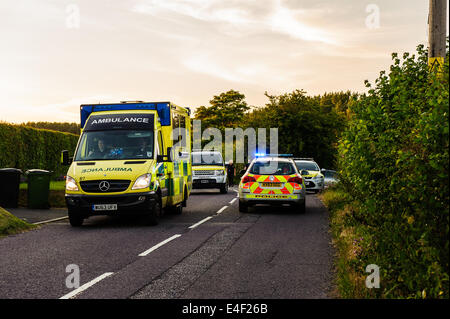 Ambulance leaving a police incident and on way to hospital at speed Stock Photo