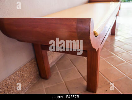 Unoccupied wooden bed chair in living room Stock Photo