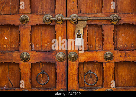 Latch with padlock on door in India Stock Photo