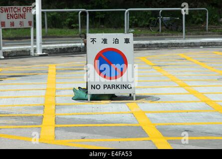 No parking cross yellow line on the ground. Yellow junction box on