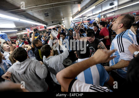 São Paulo, Brazil. 9th July, 2014. A crowd of Argentina fans celebrate their team's victory of the semifinal World Cup game between Argentina and the Netherlands in the entrance of a subway station in São Paulo, Brazil on July 9, 2014. Argentina won the game in the shootout by 4-2 and made to final. Credit:  Tiago M. Chiaravalloti/Pacific Press/Alamy Live News Stock Photo