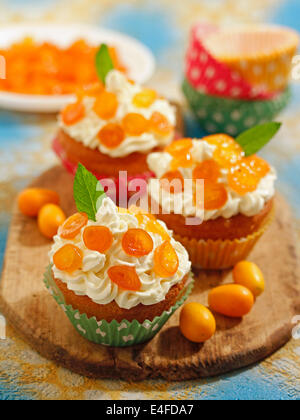 Cupcakes with kumquats. Recipe available. Stock Photo