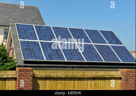 Roof covered with photovoltaic solar cells for generating electricity, Wales, UK Stock Photo