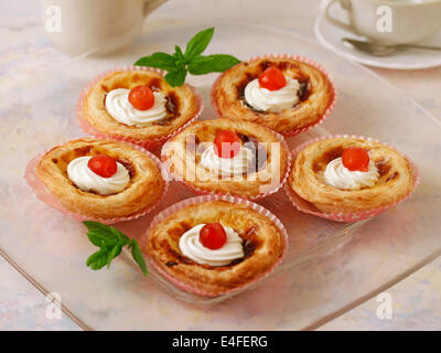 Puff pastry tartlets with custard. Recipe available. Stock Photo